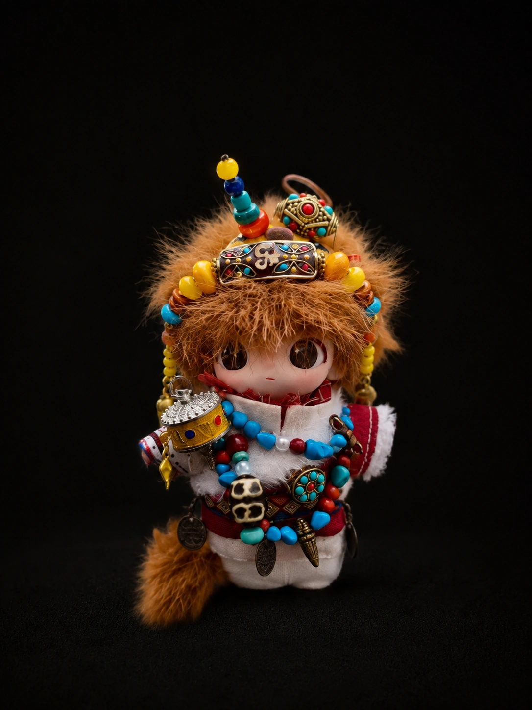 TIRAVA independently customised amber plush character with multicolour crown-like ornament and beadwork